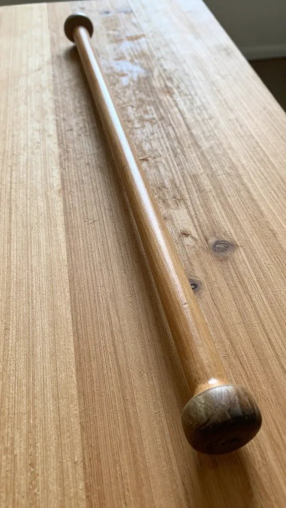 single bar resting on wooden board, natural light highlighting textures and gloss